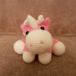 Lil pink unicorn with white mane and tail