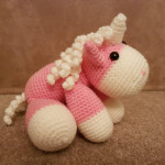 Lil pink unicorn with white mane and tail